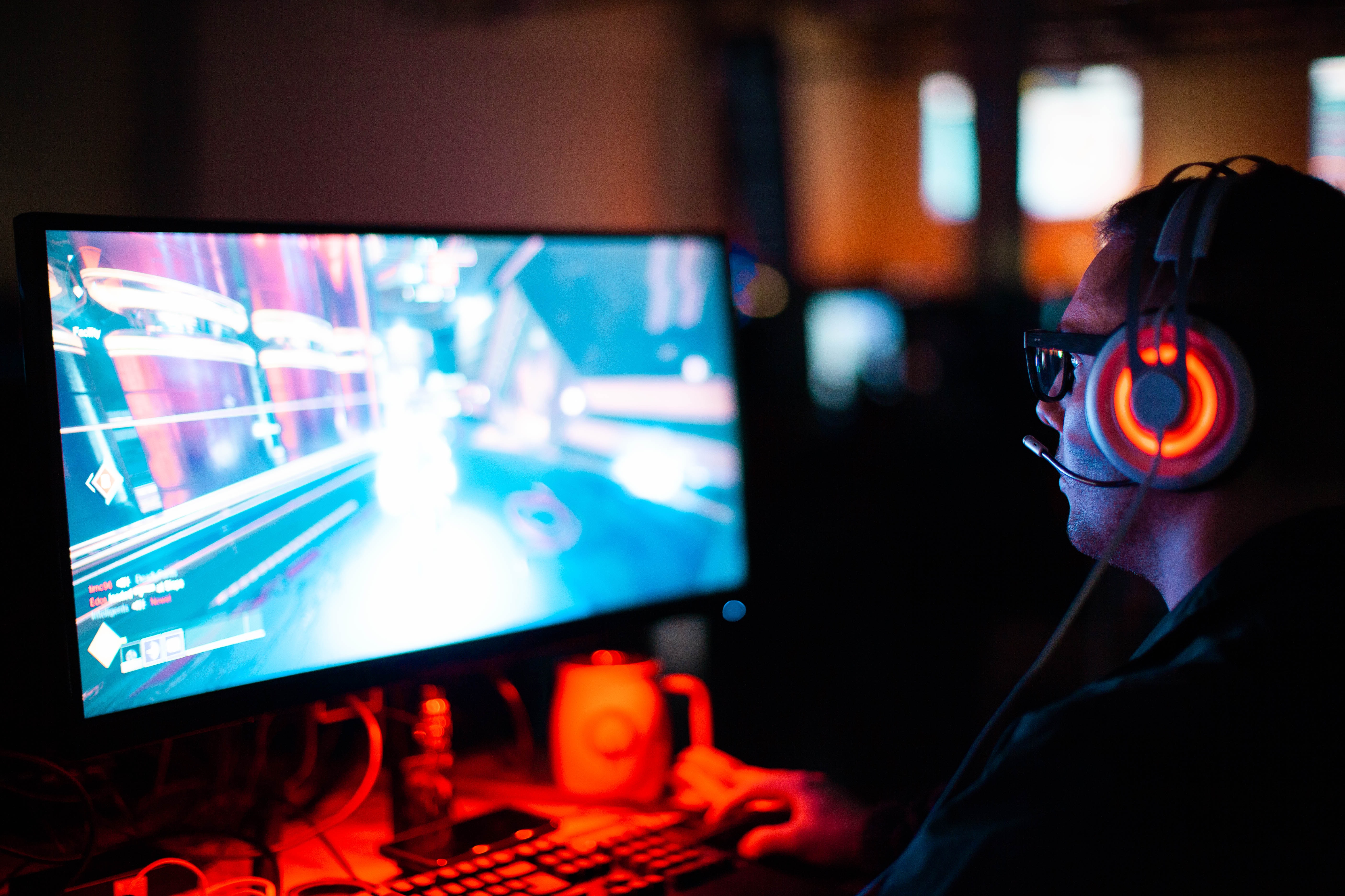 person on computer playing game - sean do